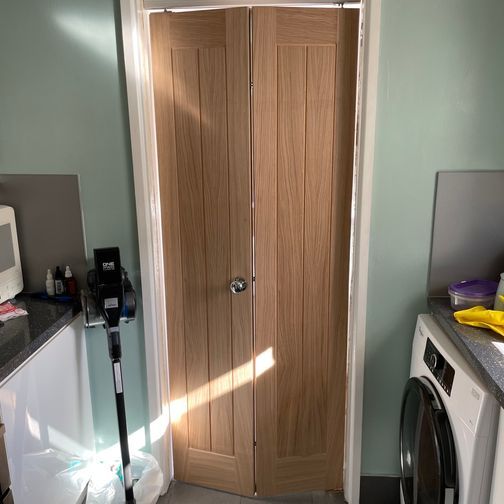 Customer image of JB Kind Thames Grooved 4 Panel Unfinished Oak Bi-Fold Door