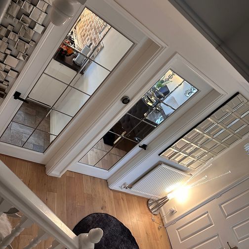 Customer image of JB Kind 1 Light Decima White Primed Glazed Internal Door